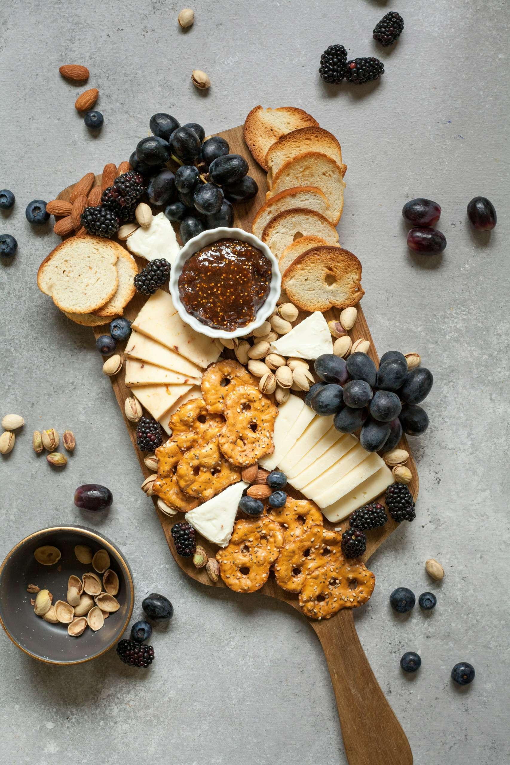 Baked breads and cookies on brown wooden board