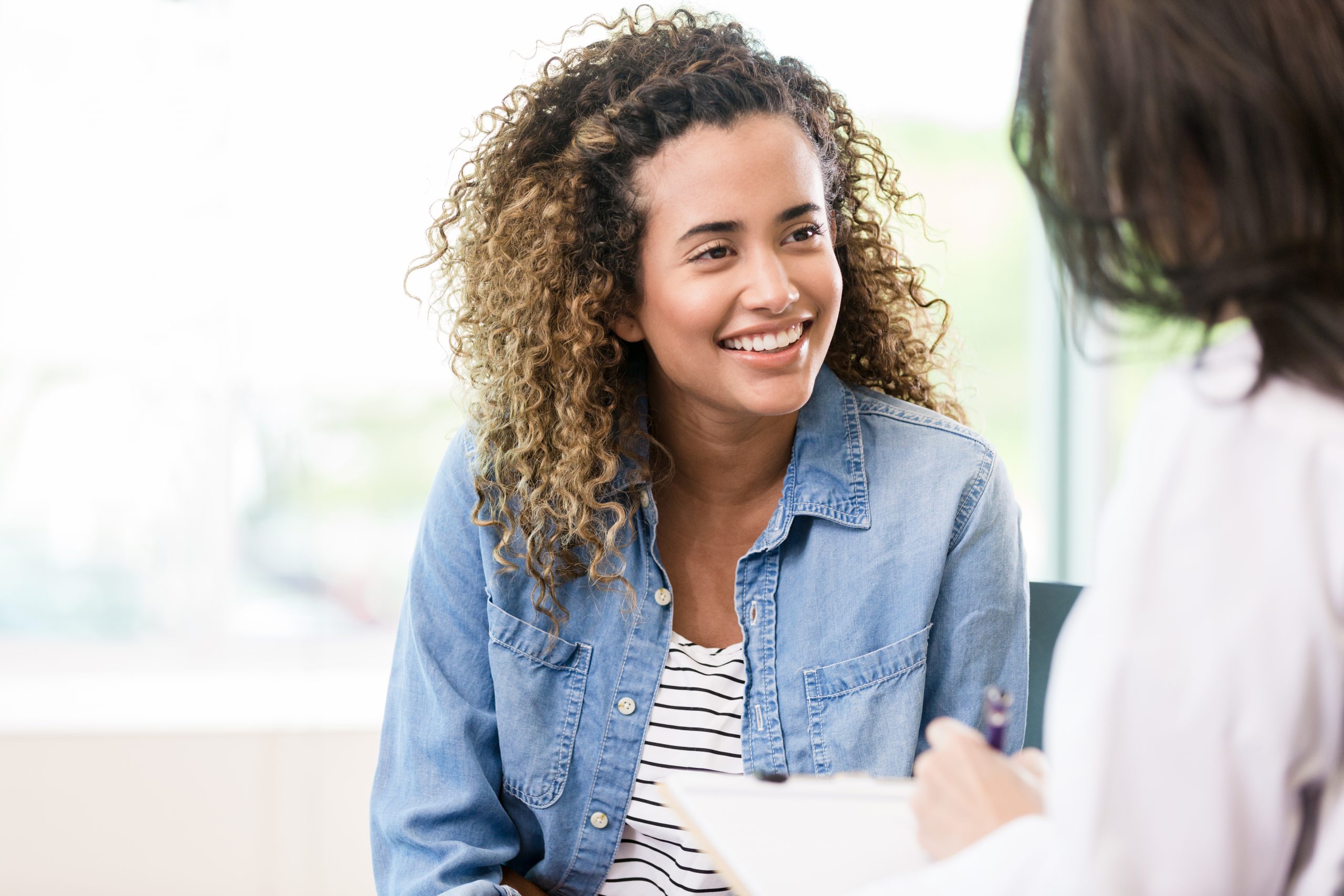 Smiling female patient receives good news